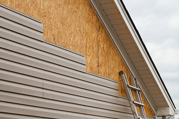 Professional Storm Damage Siding Repair technician working in Beloit, OH